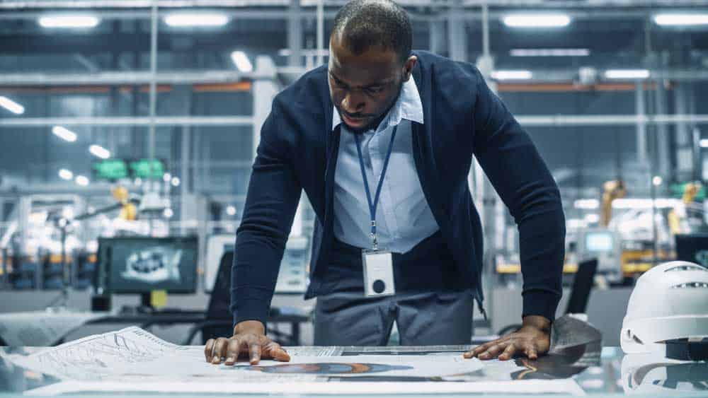 An engineer checking an assembly drawing