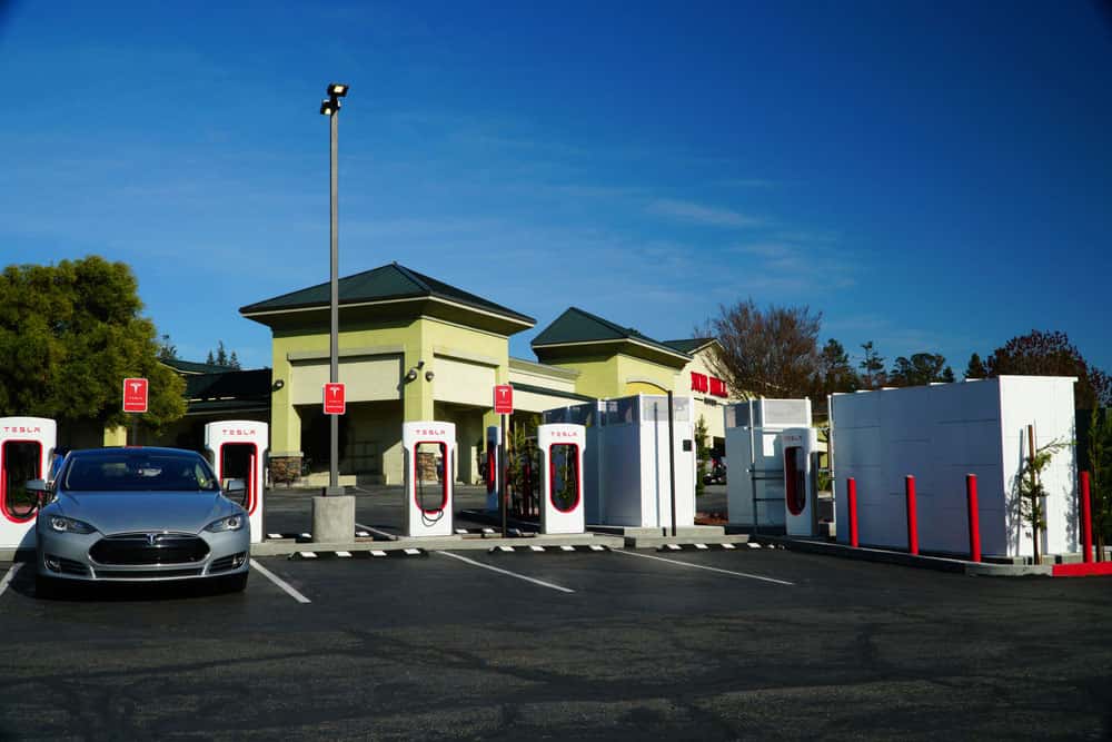 A Tesla Model S charging in a station