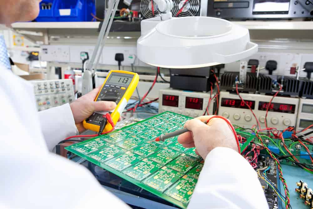 An engineer testing a circuit board