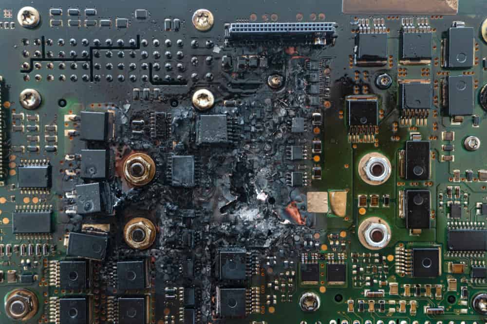 A PCB with damage from electrical short circuits