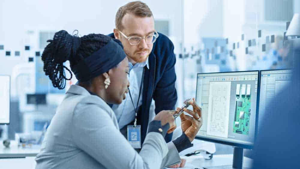 Two engineers discussing a PCB