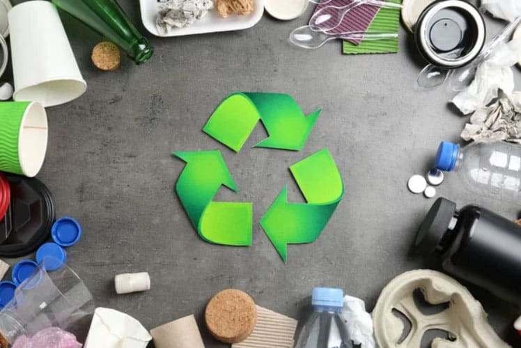 Green recycle symbol on gray background
